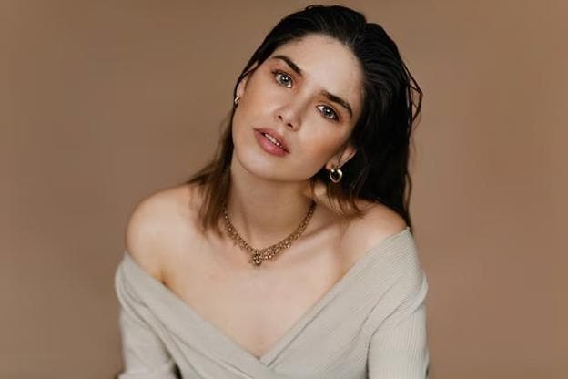 a girl wearing a necklace