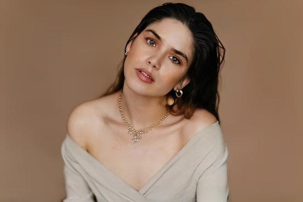 a girl wearing a necklace