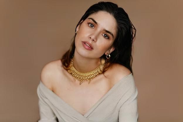 a girl wearing a necklace