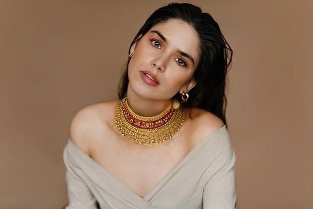 a girl wearing a necklace