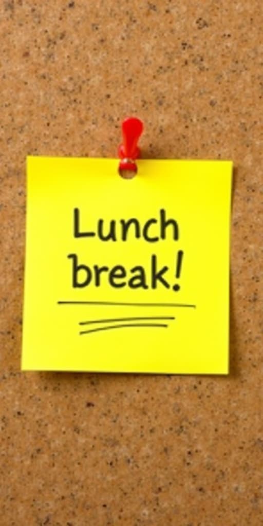  good quality, high quality, bright yellow sticky note with "lunch break!" message pinned on corkboard background