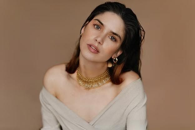 a girl wearing a necklace