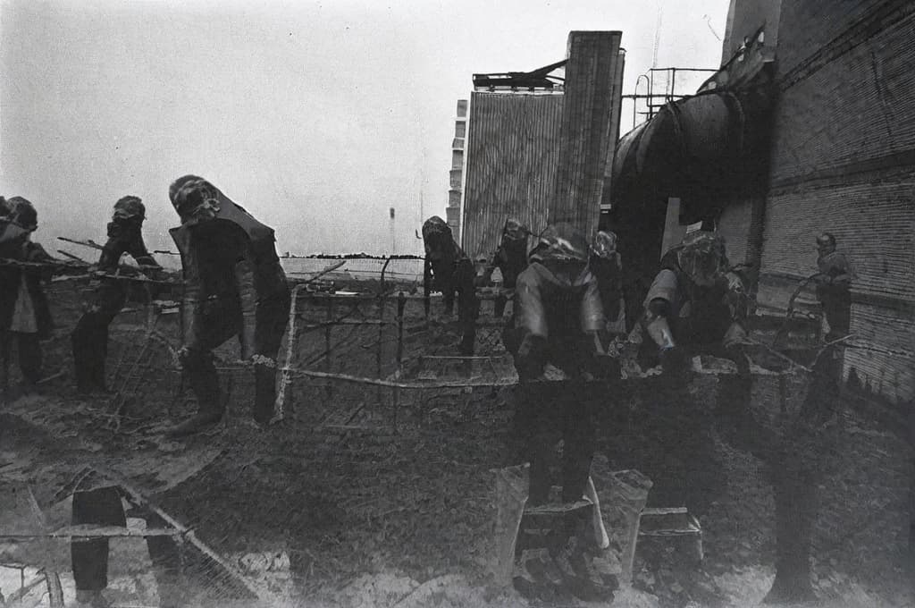  This photo was taken on September 1st 1986, exactly 128 days, or 4 months and 4 days, after the Chernobyl catastrophe took place. It captures my first day at in Gomel, Belarus. I had just turned that summer. In the photo, one can see my clmates and our teacher. Some are standing with their arms hanging beside their bodies, while others are seated on a low bench with their hands neatly placed on their . The students are arranged in three lines: 10 in the 3rd (top) back line, 9 in the 2nd (middle) line, and 13 in the 1st front line, totaling 32 students. There are 17 boys and 15 s, distinguished by the dress code. My friend Genadi is 4th from the right in the 3rd (top) line. I am seated in the very center of the