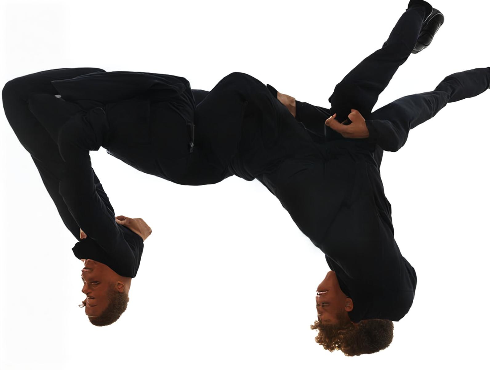  Ultra realistic side view of a young adult male person performing backflip, Canon EOS R3, f/1.4, symmetrical balance, rule of thirds, (professionally color graded), (centered image composition).