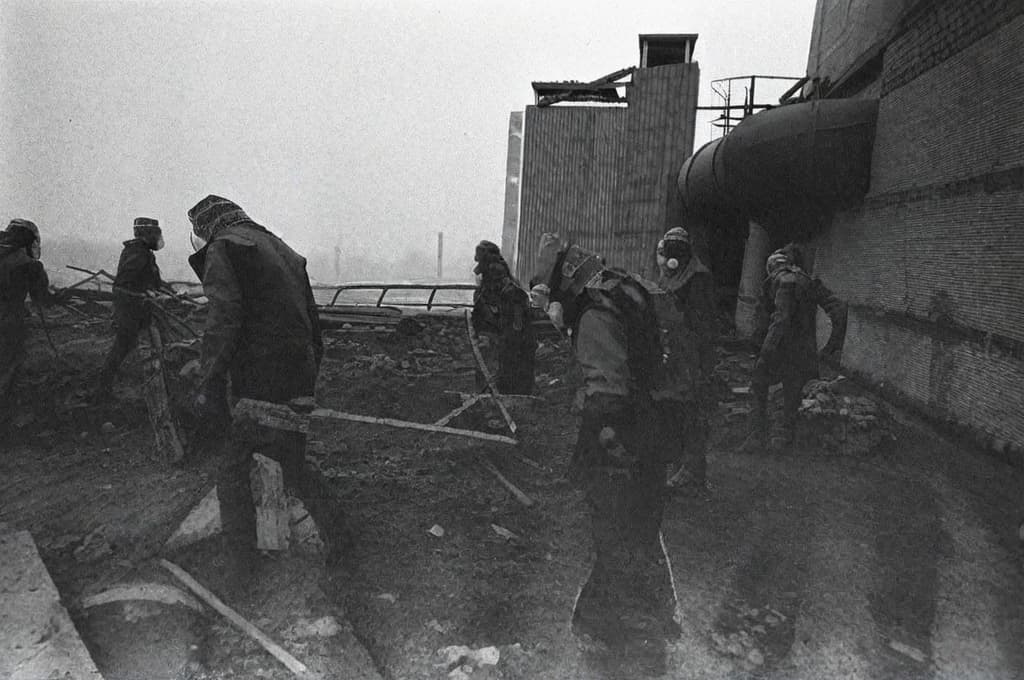  This photo was taken on September 1st 1986, exactly 128 days, or 4 months and 4 days, after the Chernobyl catastrophe took place. It captures my first day at in Gomel, Belarus. I had just turned that summer. In the photo, one can see my clmates and our teacher. Some are standing with their arms hanging beside their bodies, while others are seated on a low bench with their hands neatly placed on their . The students are arranged in three lines: 10 in the 3rd (top) back line, 9 in the 2nd (middle) line, and 13 in the 1st front line, totaling 32 students. There are 17 boys and 15 s, distinguished by the dress code. My friend Genadi is 4th from the right in the 3rd (top) line. I am seated in the very center of the