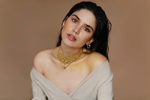 a girl wearing a necklace