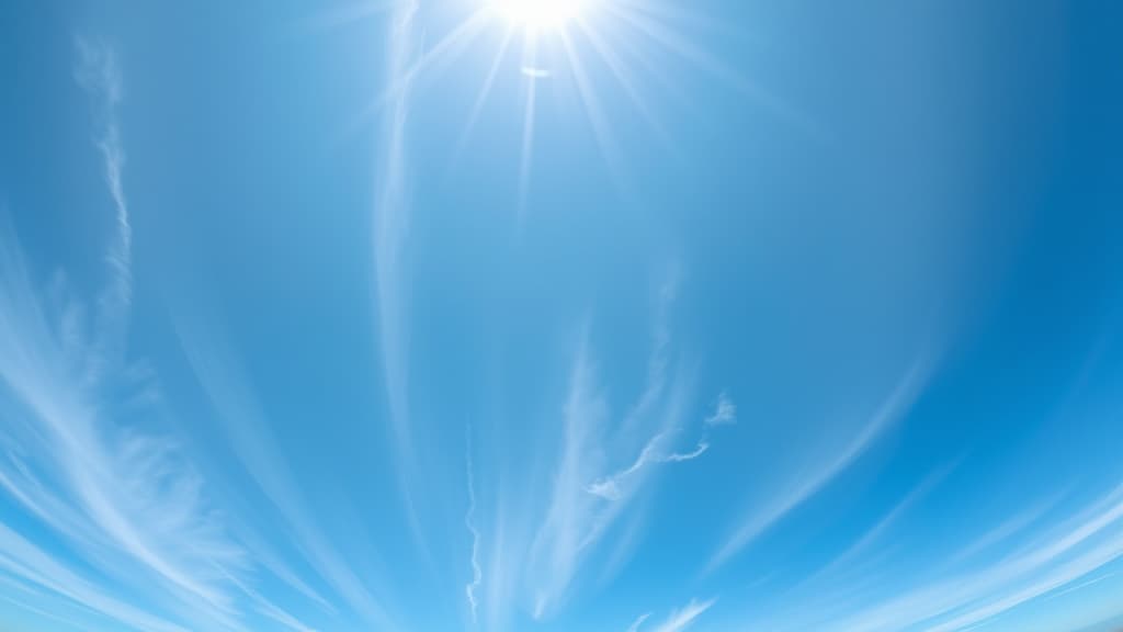  a panoramic shot of delicate cirrus clouds high in the sky, stretched thin across the blue expanse, shot during midday with a nikon z7 ii, 28mm lens, vibrant colors