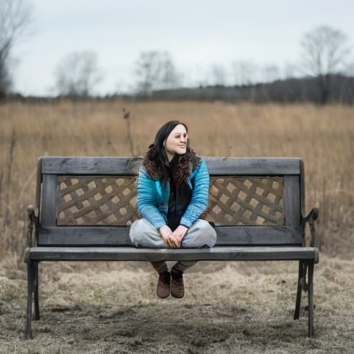  a woman sitting on a bench