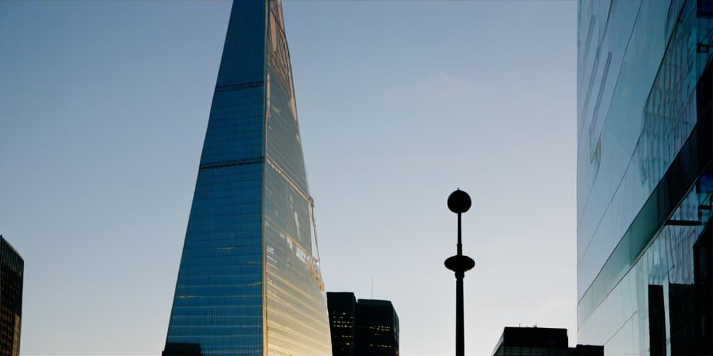  skyscraper, (zenithal angle), sunset, ((by lwan baan)), lora:xsarchi 127:0.75> big tower building, blue sky, cinematic, shining sun on city